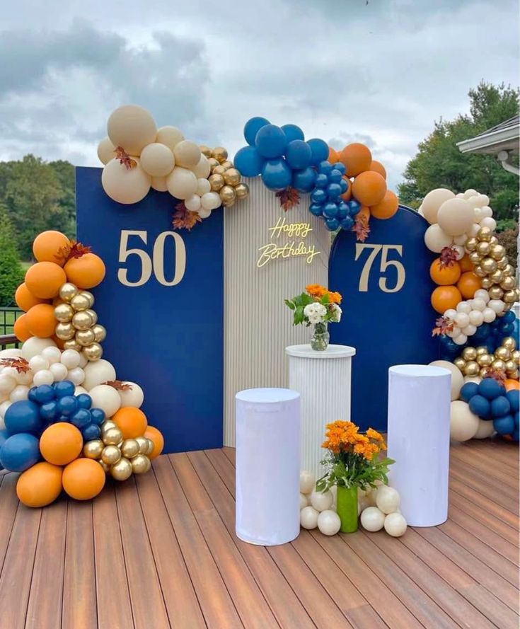 Modern Navy Blue And Gold Milestone Birthday Decor With Balloon Arch And Pedestal Display - birthday decoration by ARV Decor