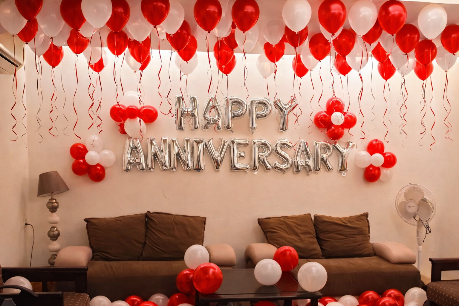 Red And White Anniversary Decor With Balloon Ceiling And Silver Letter Balloons - anniversary room decoration by ARV Decor