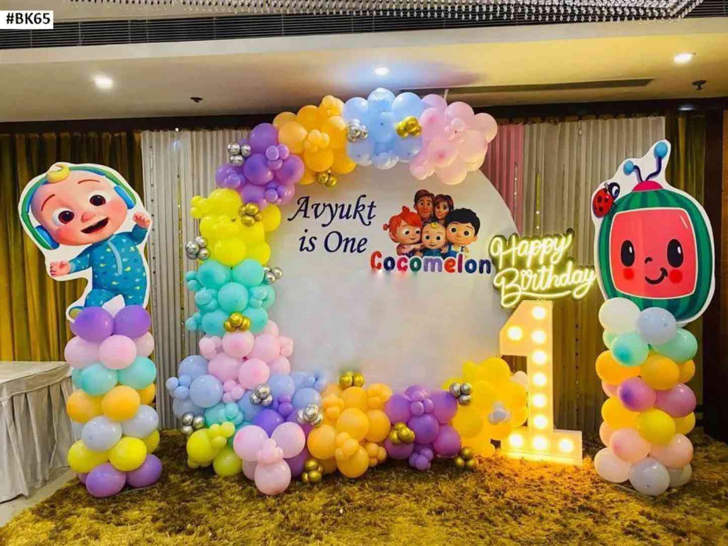 Cocomelon Themed 1st Birthday Decor With Pastel Balloon Arch And Neon Happy Birthday Sign - birthday decoration by ARV Decor