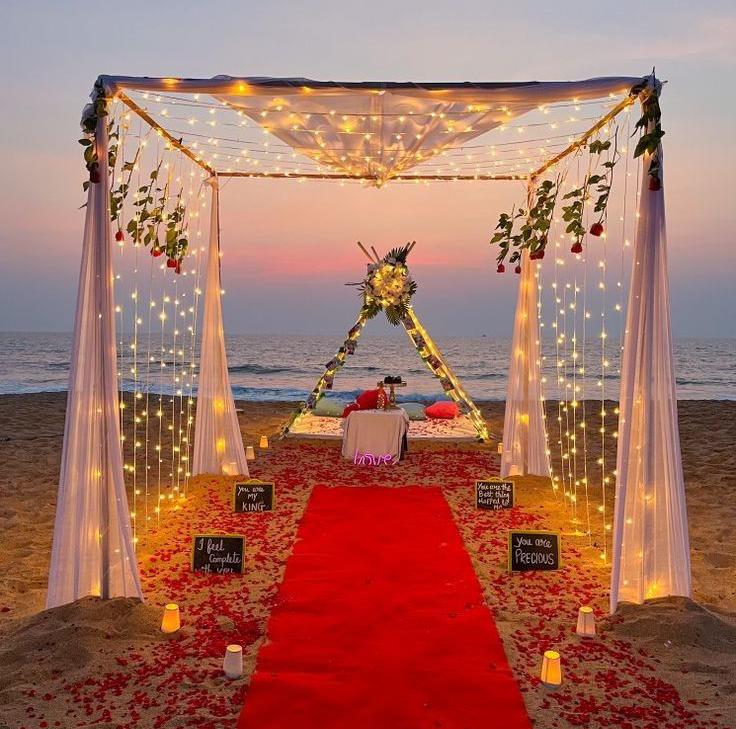 Romantic Beach Anniversary Setup With Red Carpet And String Lights - anniversary room decoration by ARV Decor