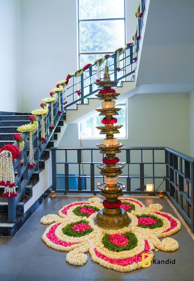 Traditional Indian Entrance Decor With Brass Lamp And Flower Rangoli - balloon and flower decoration by ARV Decor
