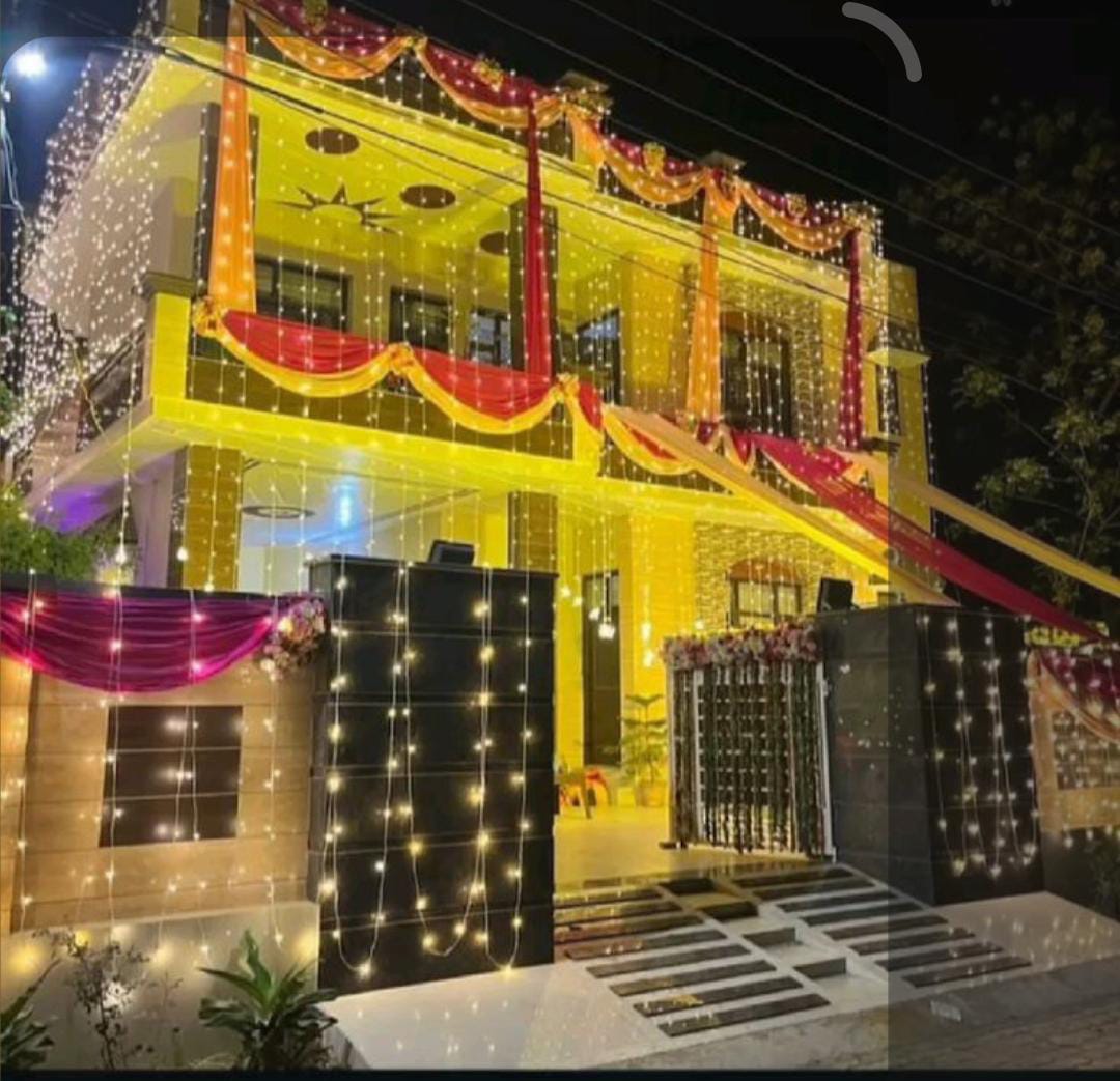 Traditional Wedding House Decor With Yellow And Red Lighting And Drapes - wedding decoration by ARV Decor