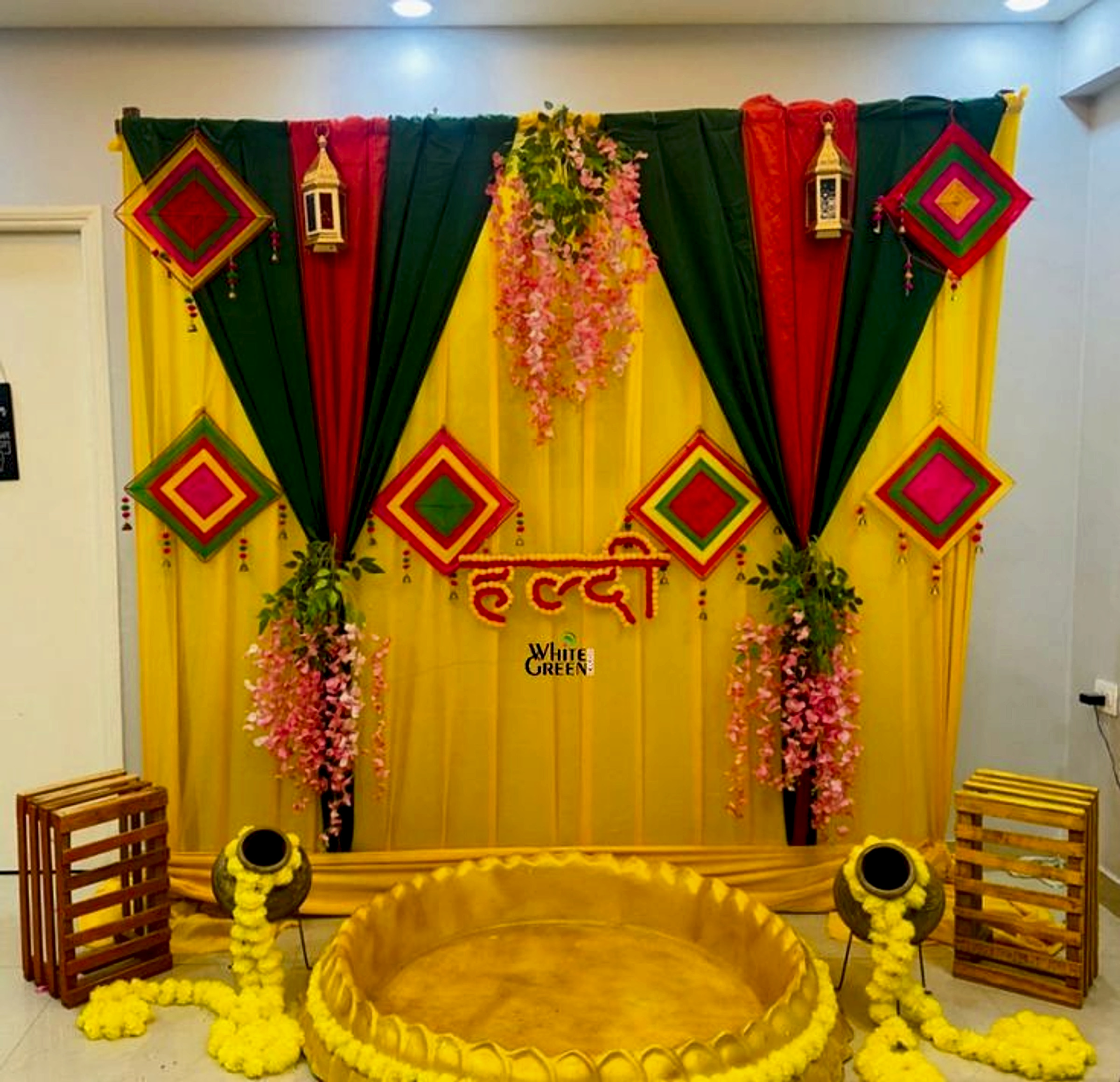 Traditional Haldi Ceremony Decoration With Yellow Green Backdrop And Floral Elements - wedding decoration by ARV Decor